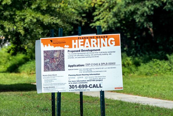 Planning Board Public Hearing sign or a proposed development