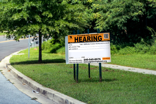 Planning Board Public Hearing sign or a proposed development