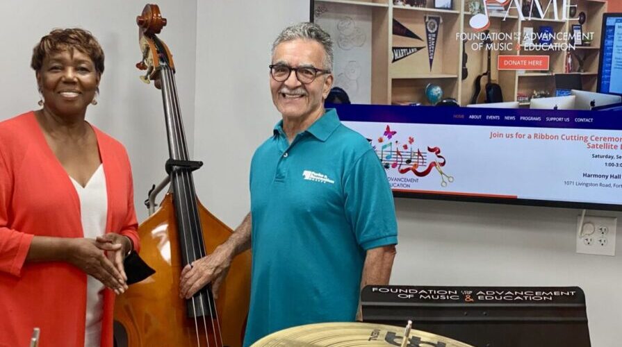 black and white older employees with musical instruments at FAME foundation for the advancement of music education